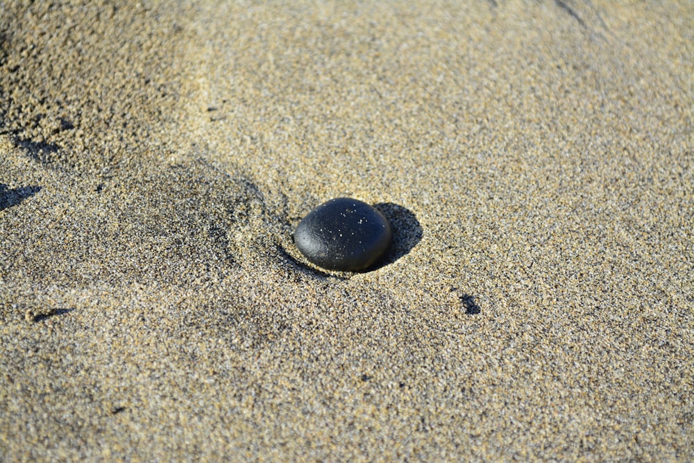 black rock on sand