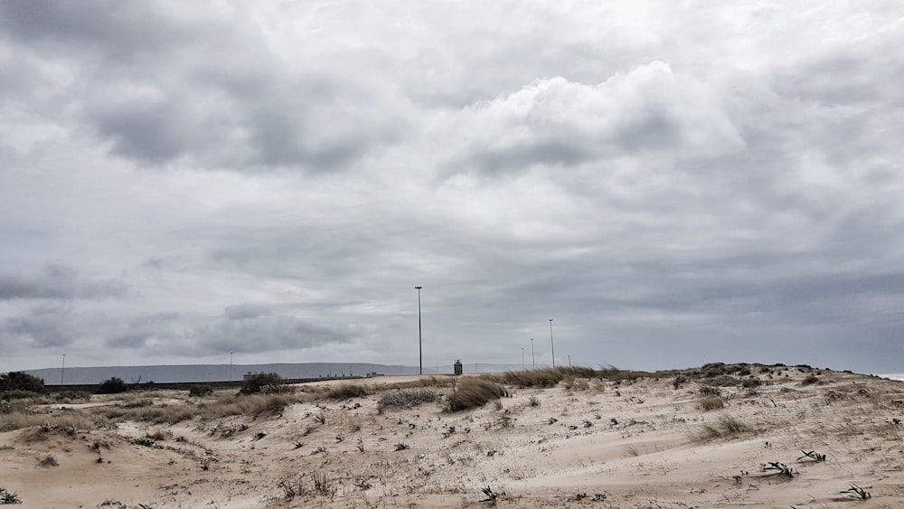 grey cloudy sky over brown desert