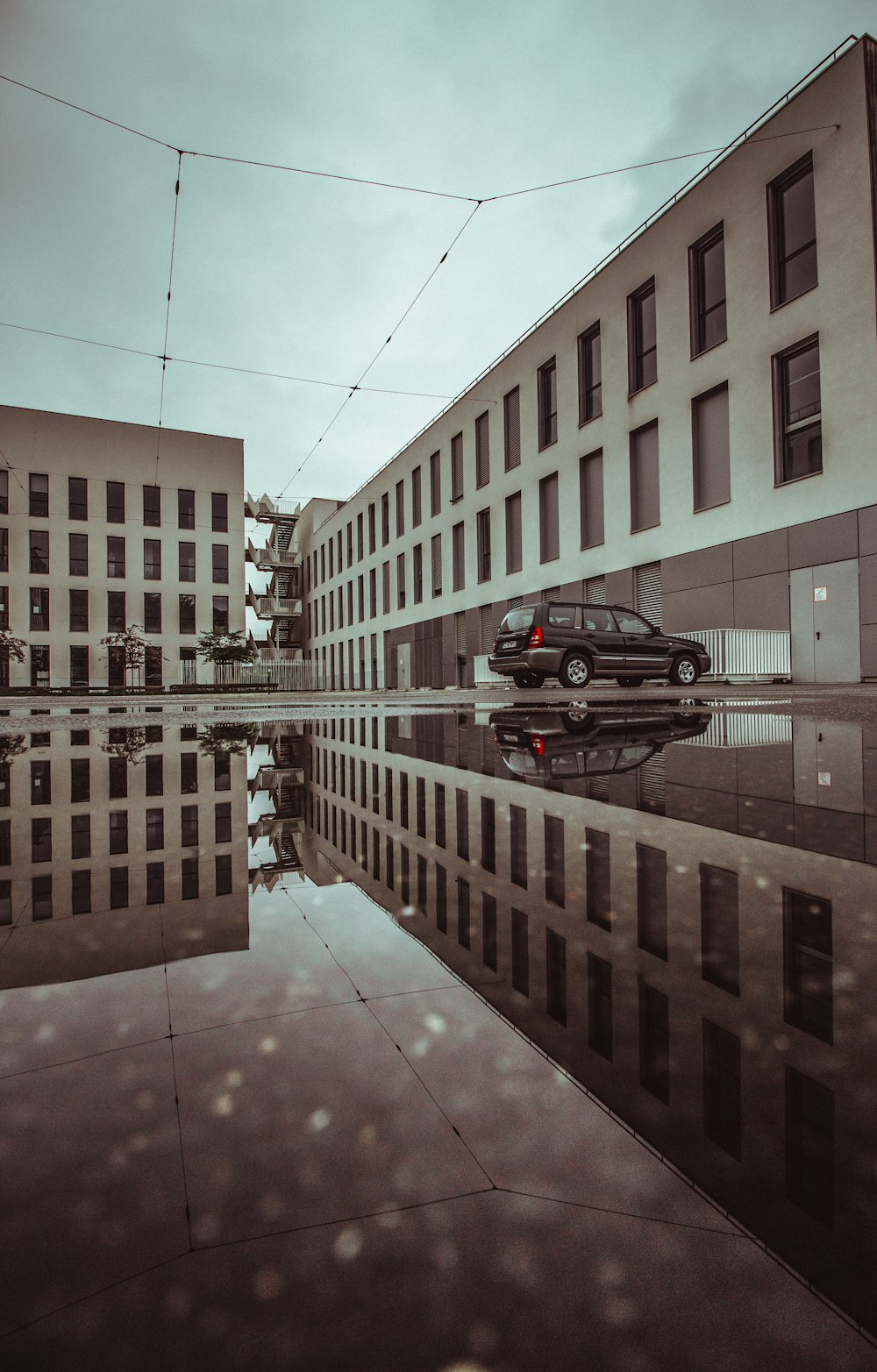 black SUV parked beside building