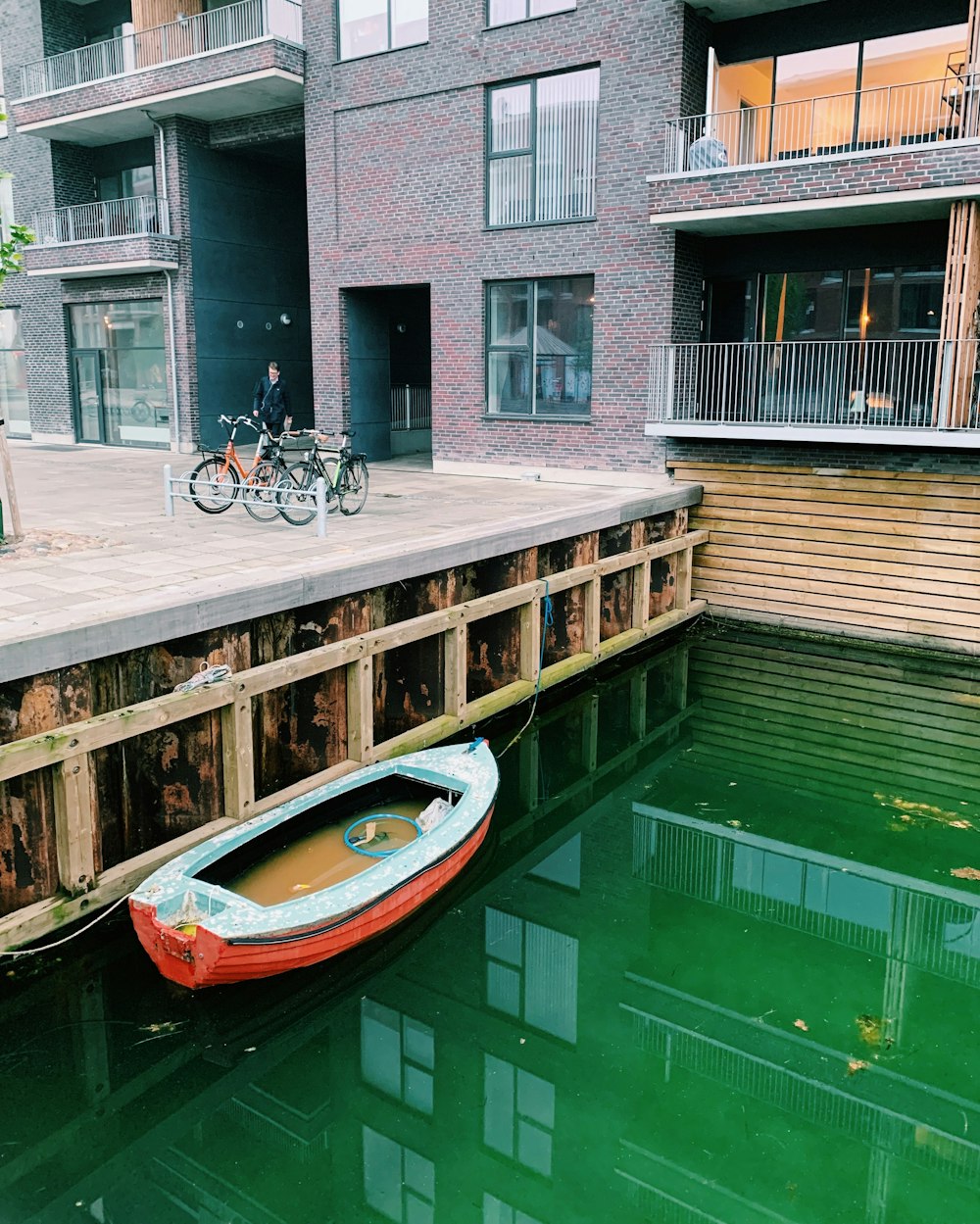 canoe boat docking near bike rack