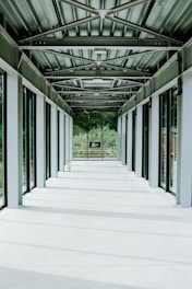 Modern hospital corridor with natural light and clean architectural lines.