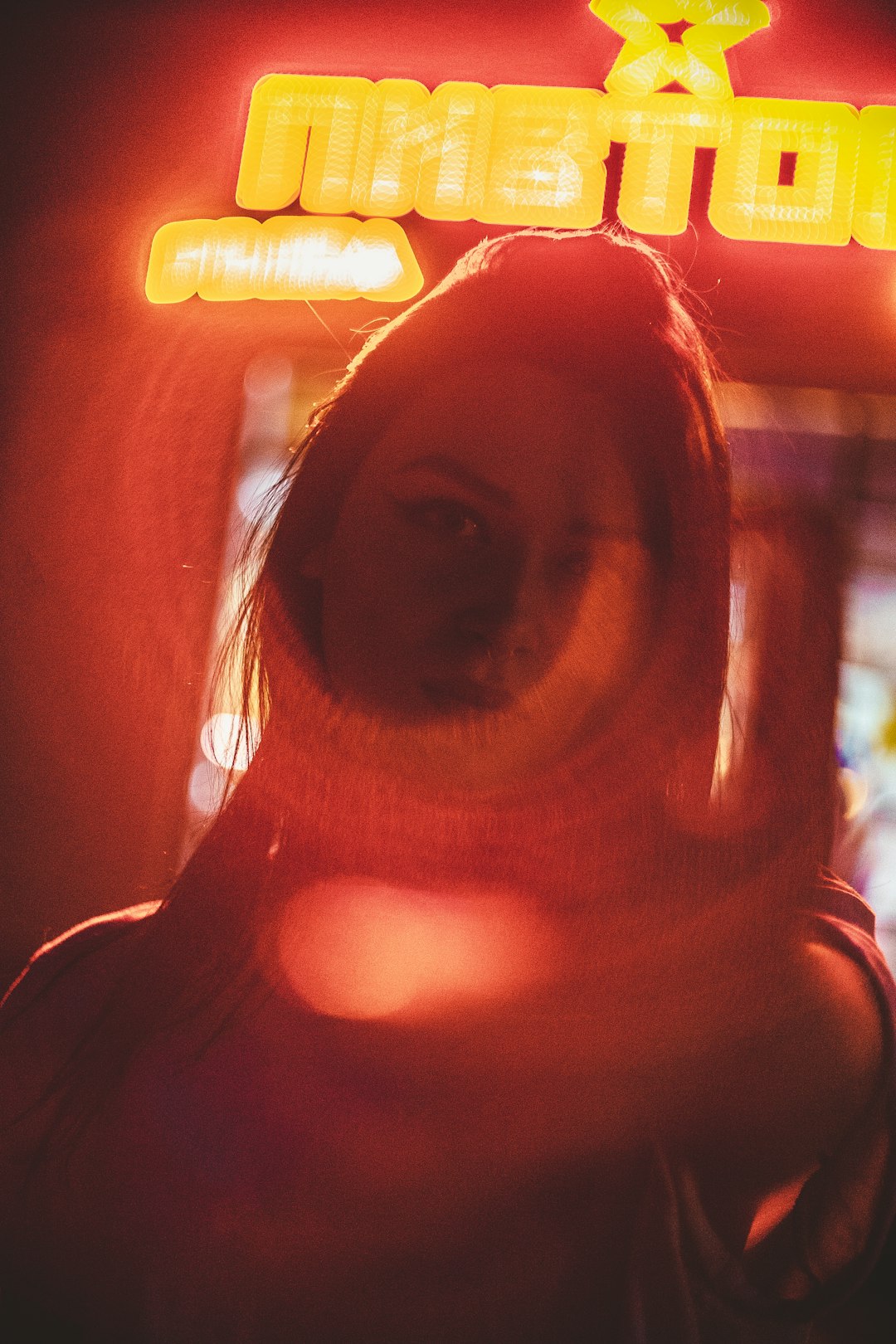 woman in red lit room