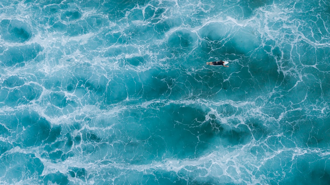 aerial photography of surfer on body of water