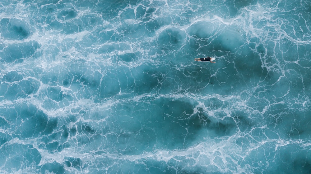 aerial photography of surfer on body of water