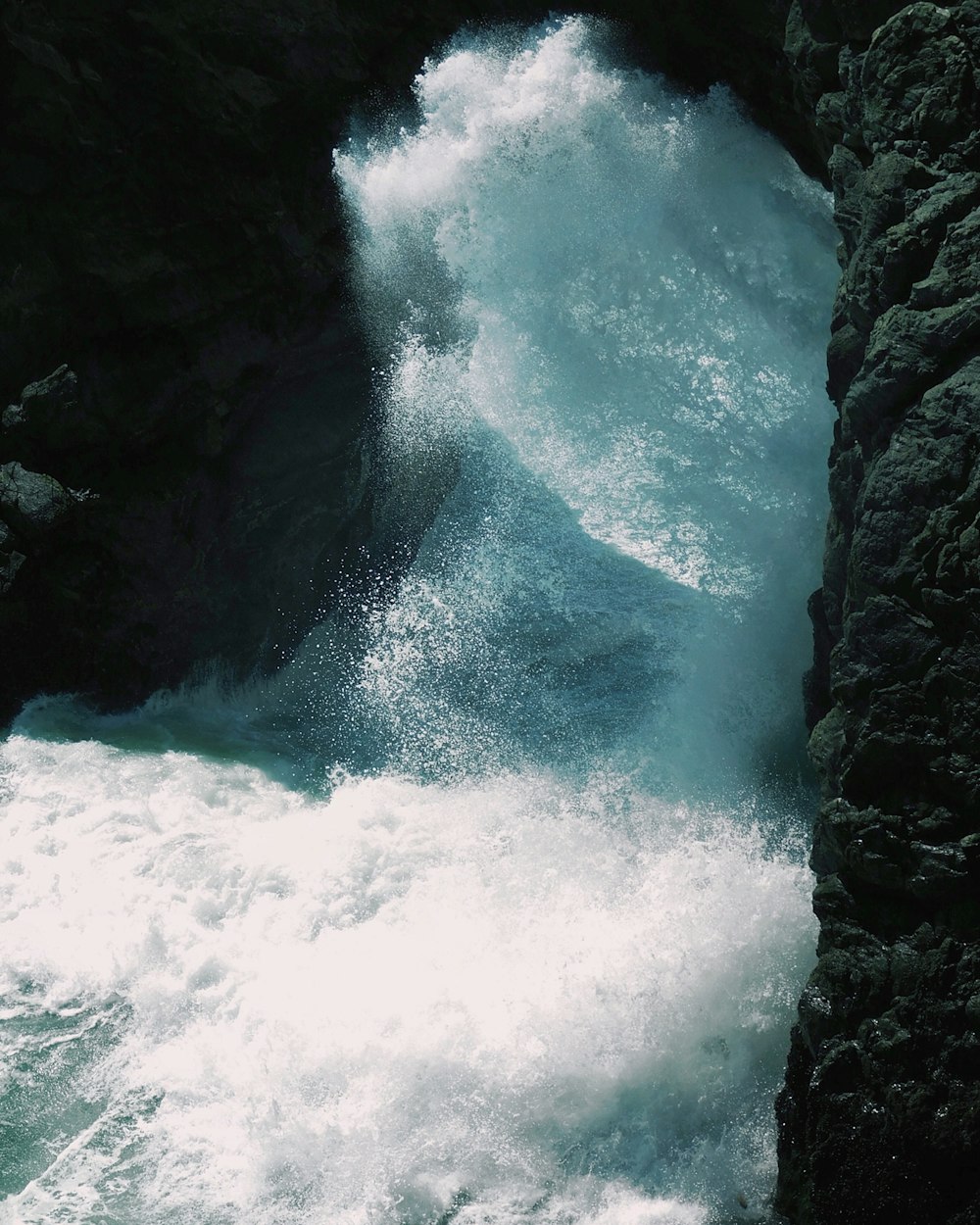 water waves near rock formation