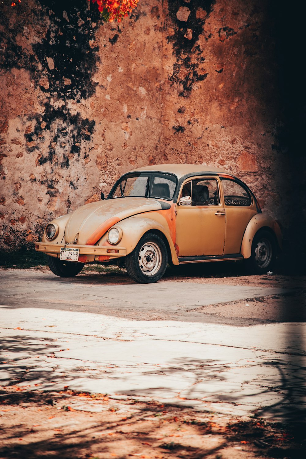 parked brown Volkswagen Beetle