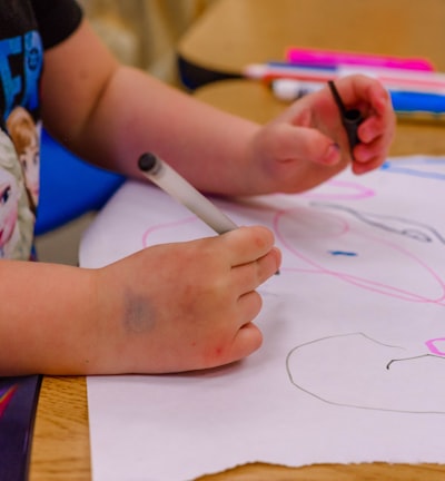Kids drawing on paper at Souls Harbor DayCare