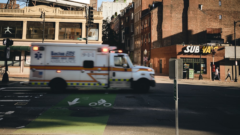 white ambulance near building