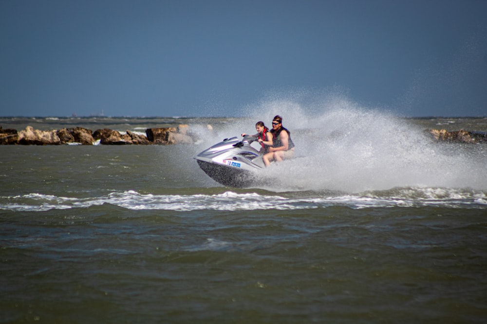 two people on a jet ski in the water
