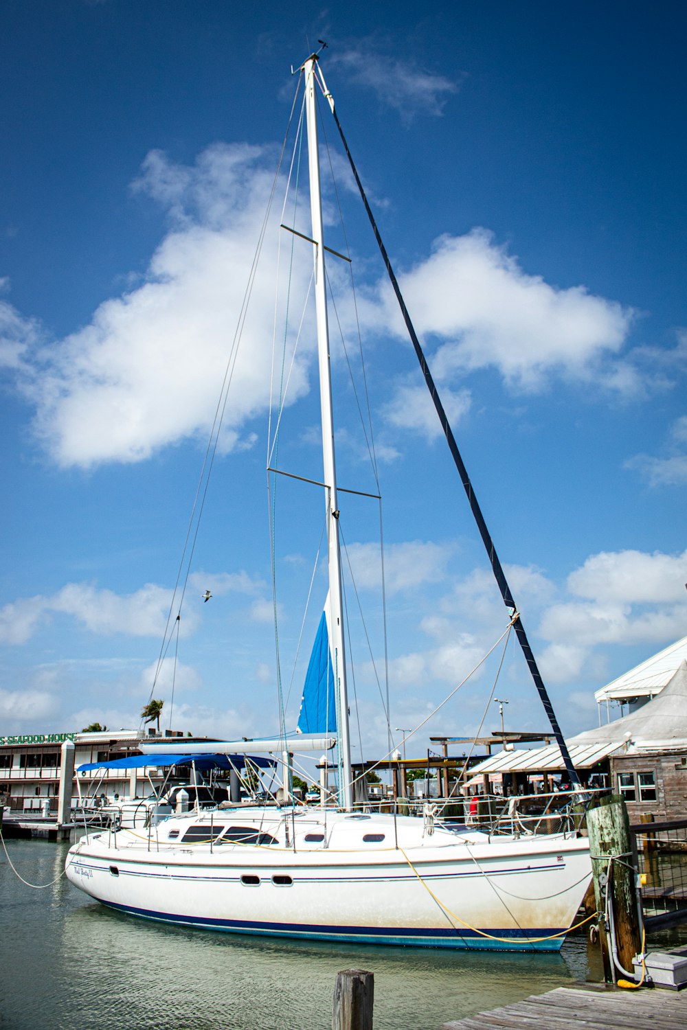 a sailboat is docked at a dock