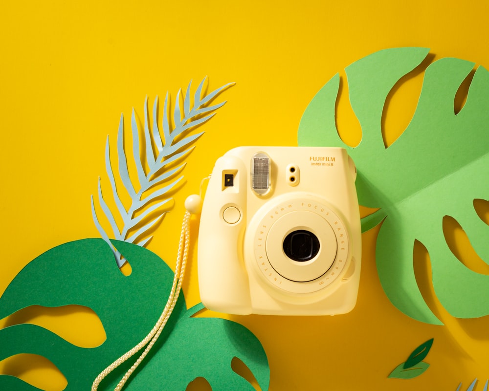 yellow Fujifilm instant camera