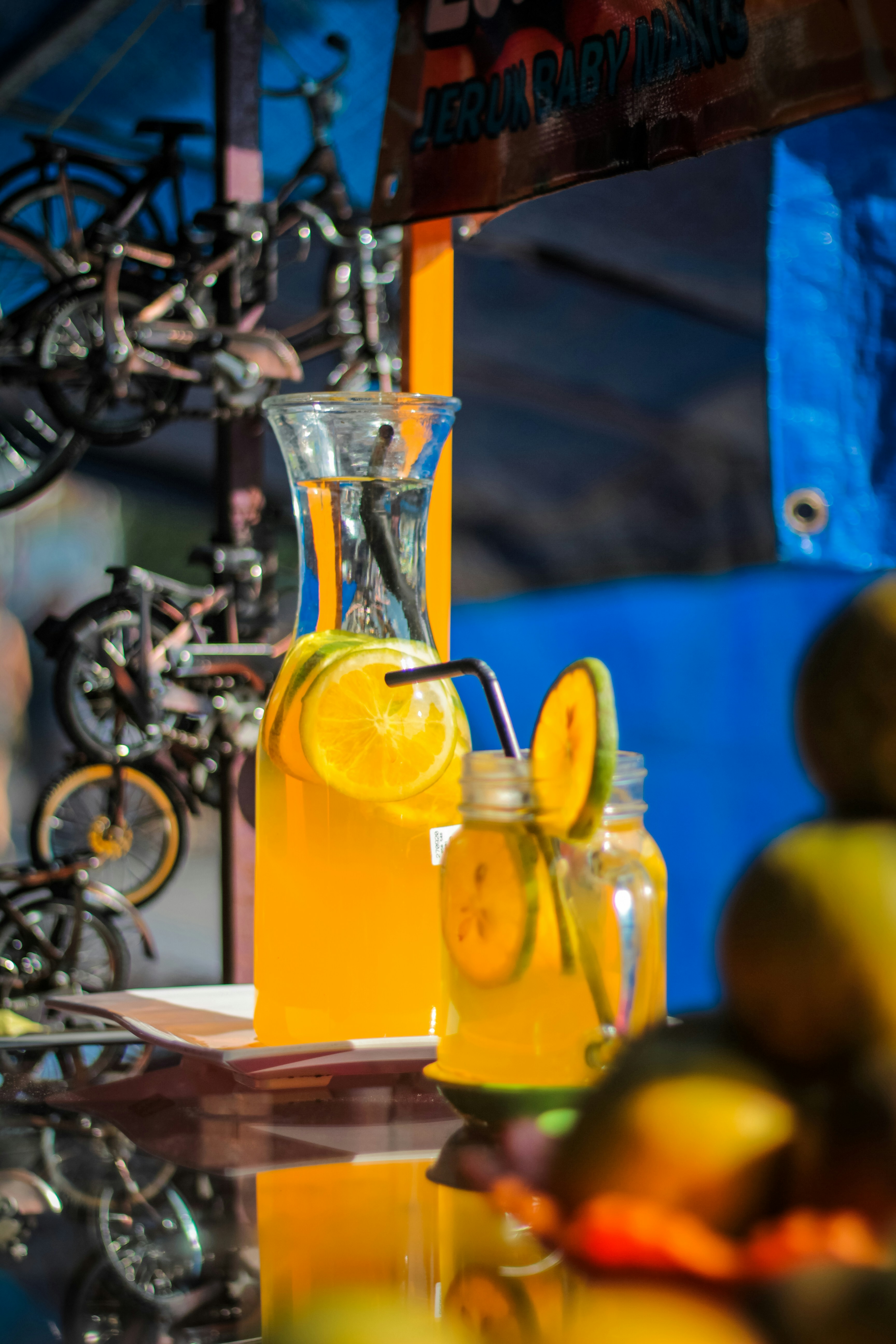 clear glass pitcher on black table