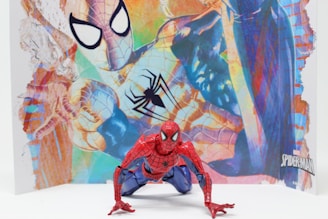 A Marvel superhero action figure posed dynamically against a cityscape backdrop.