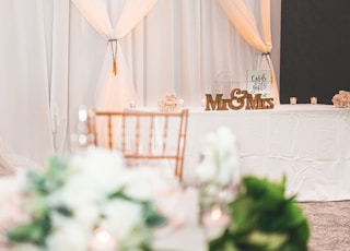 selective focus photography of chair beside table