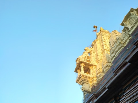 Close-up of the beautifully sculpted pillars supporting the temple roof.