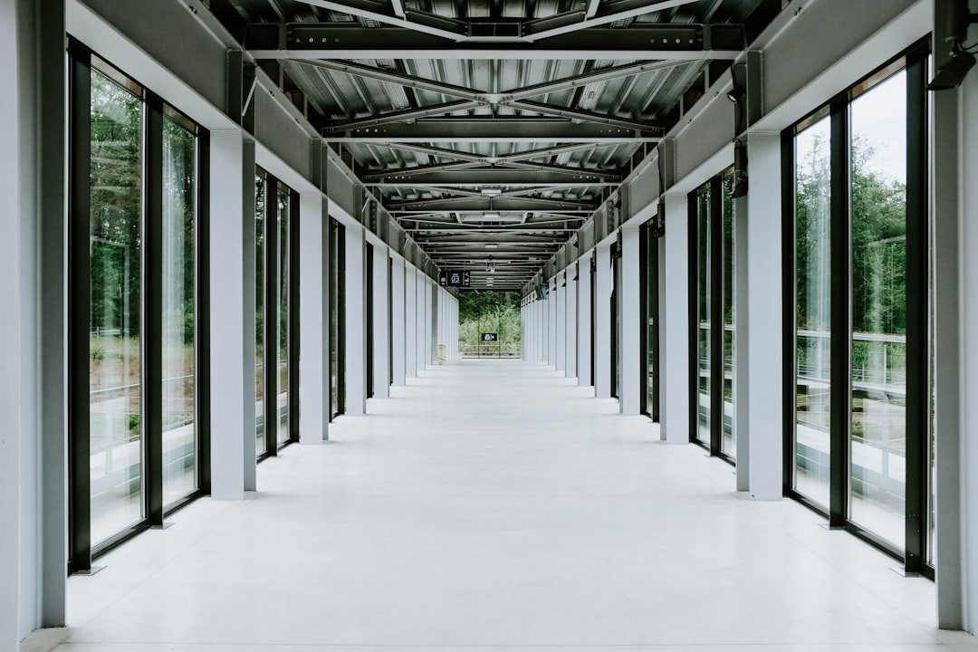 white hallway with glass walls