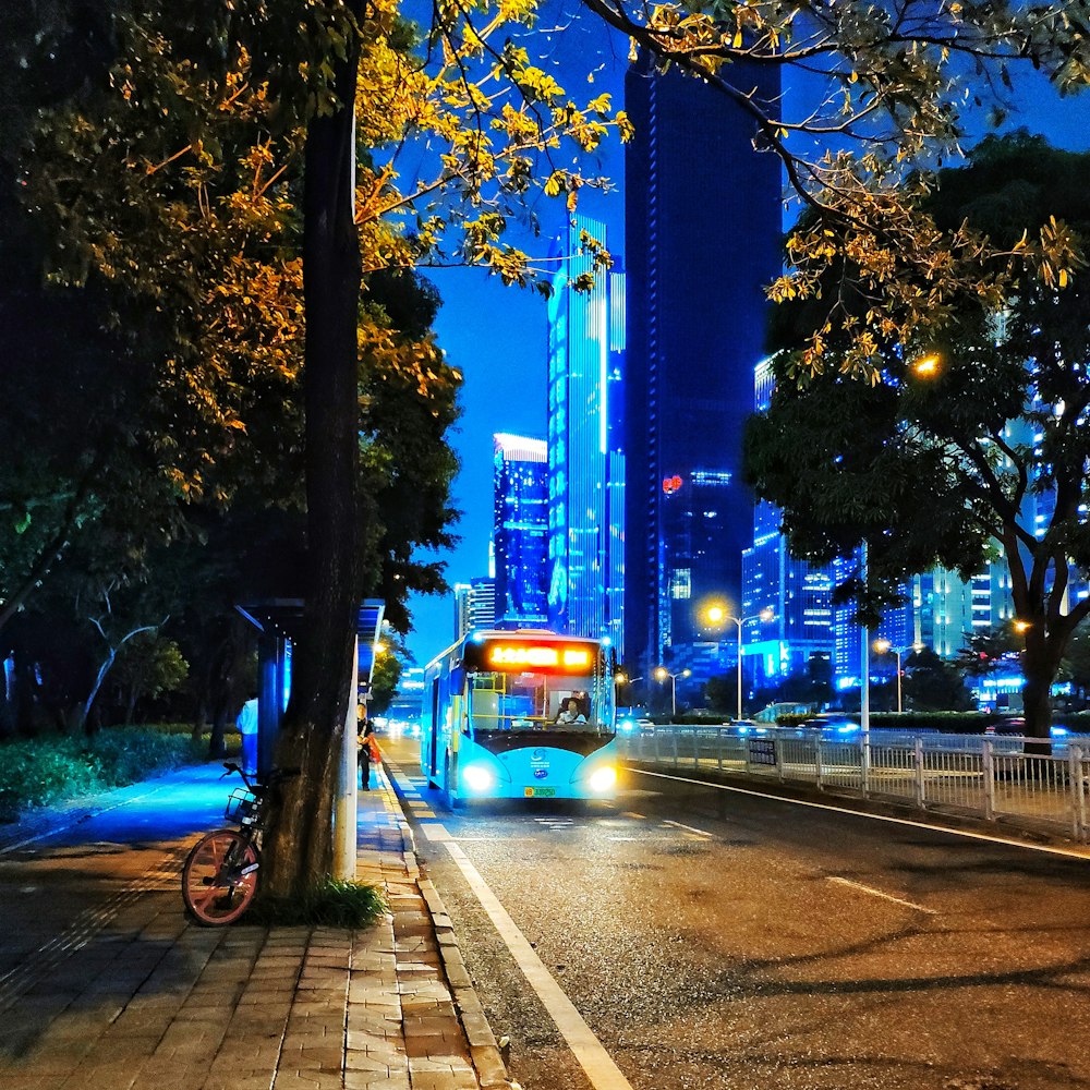 white bus on paved road