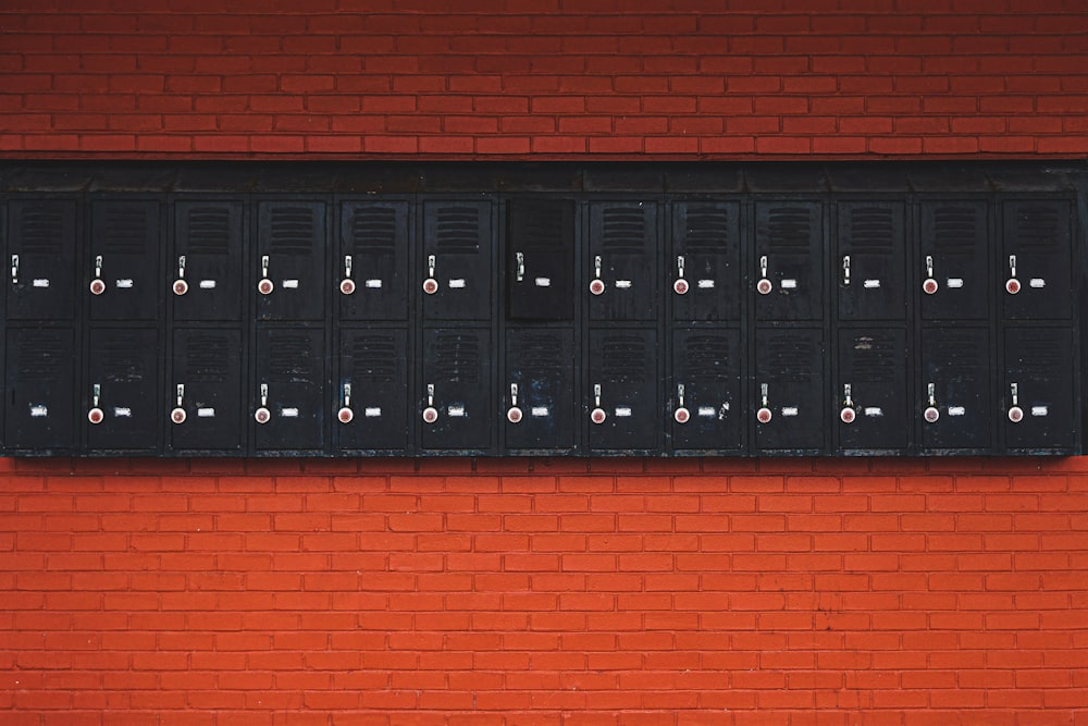 black lockers on red stonewall