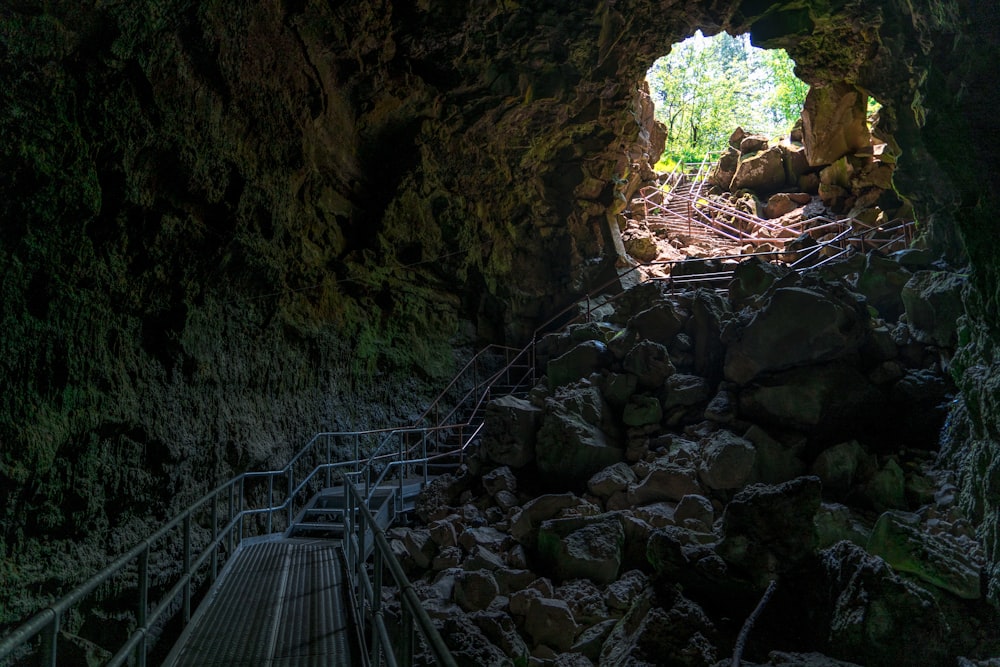 gray bridge inside cave