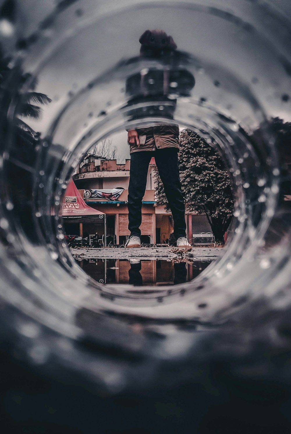 person standing near bottle