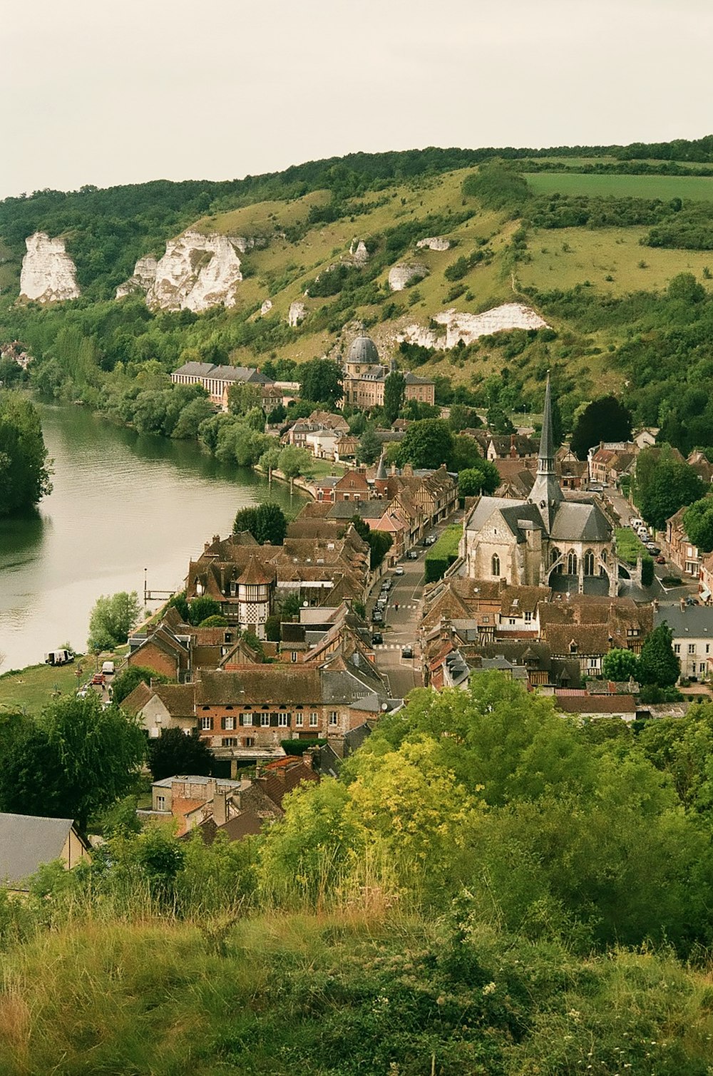 brown concrete houses beside water