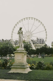 gray concrete woman standing statue during daytime