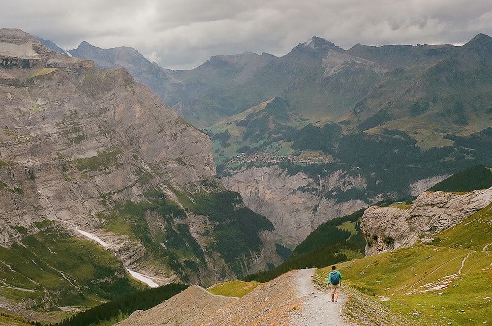 man walking near mountain