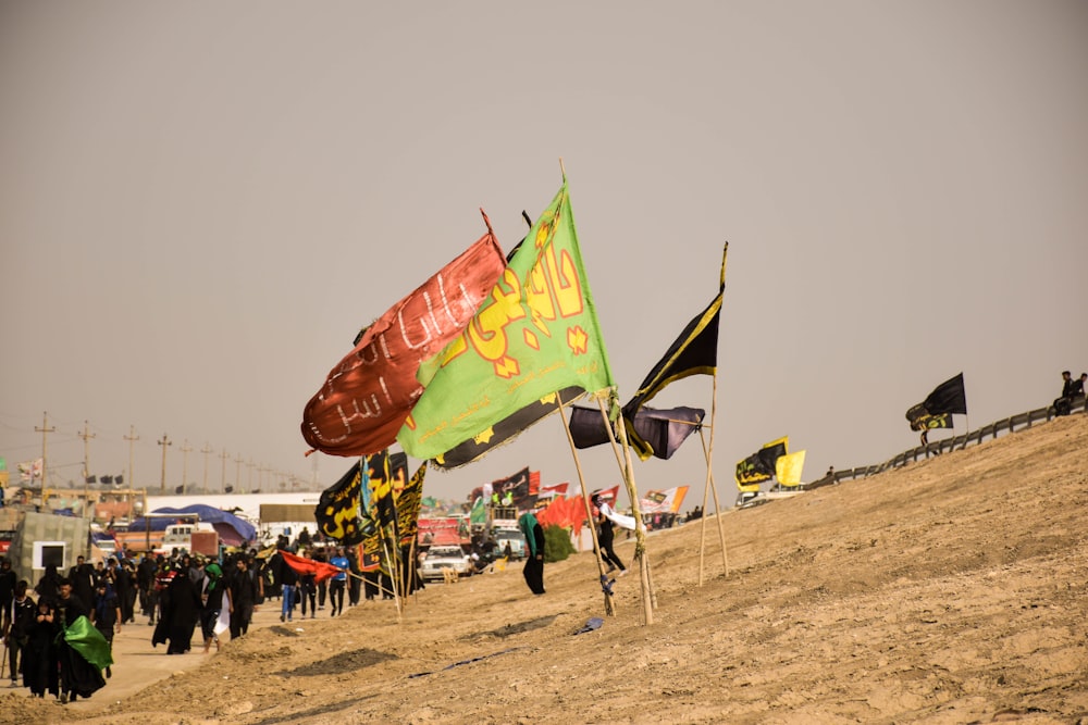 people standing on brown field