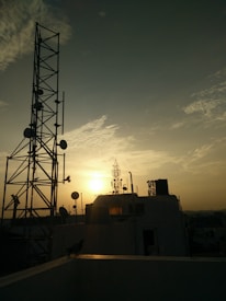 white concrete building beside black post
