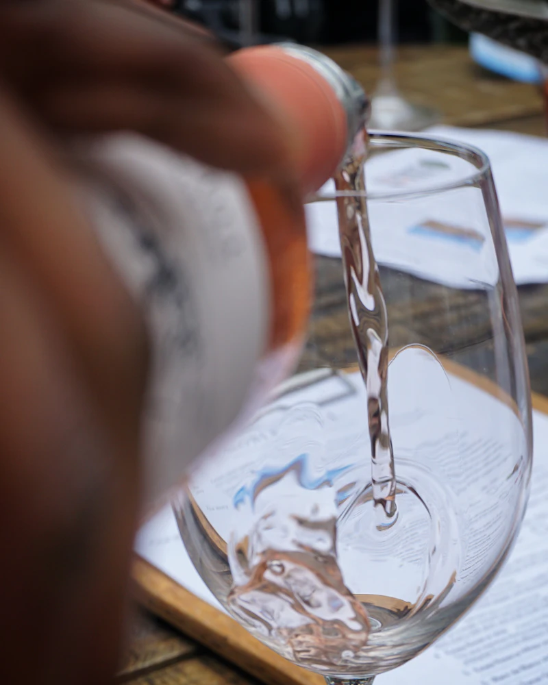 White wine being poured at a Cape wine tasting