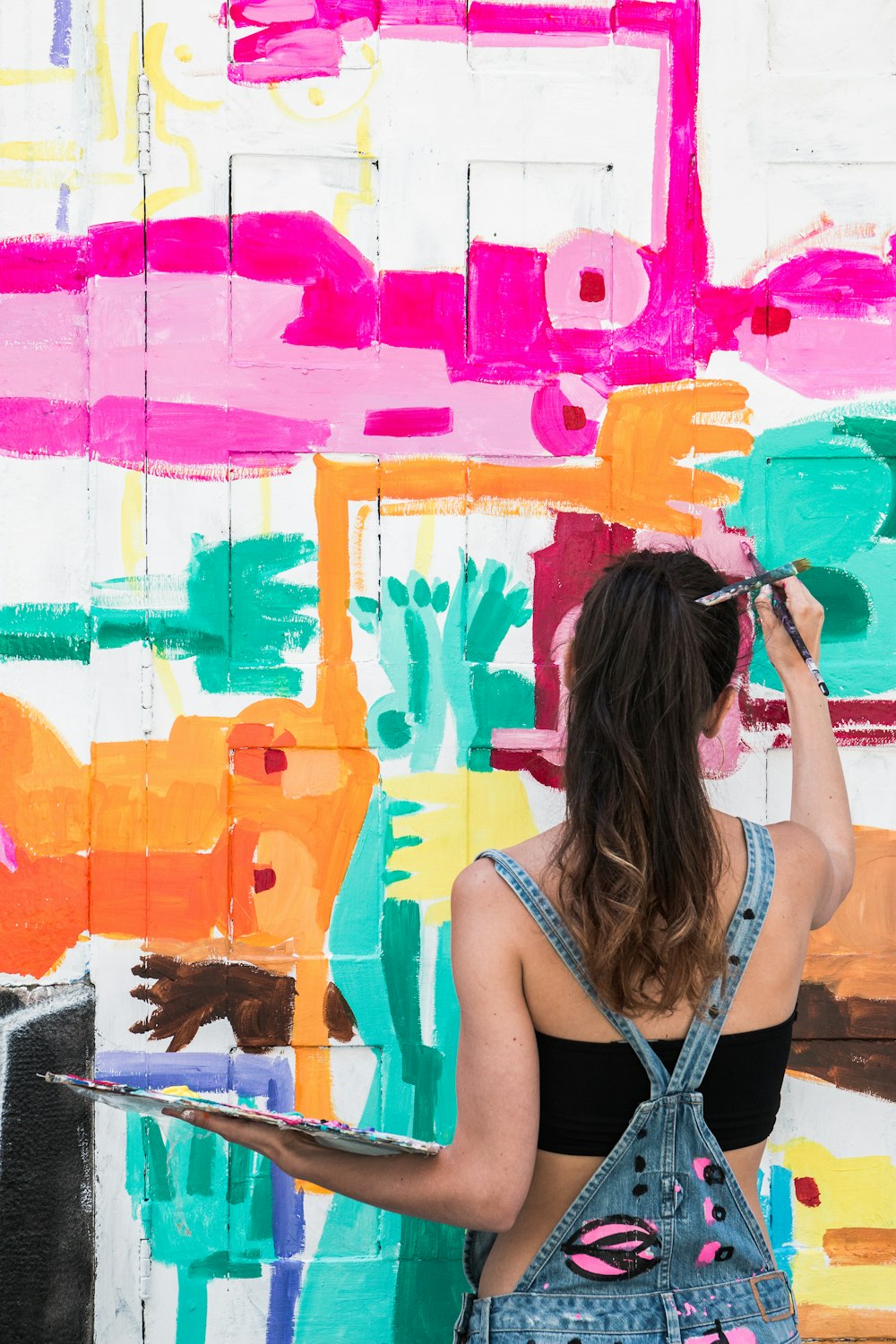 woman painting during daytime