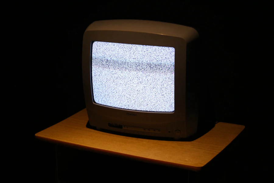 A vintage CRT screen glowing in the dark, the phosphor bloom visible around the image