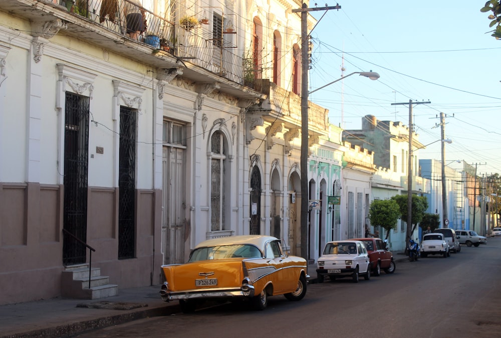 orange car beside building