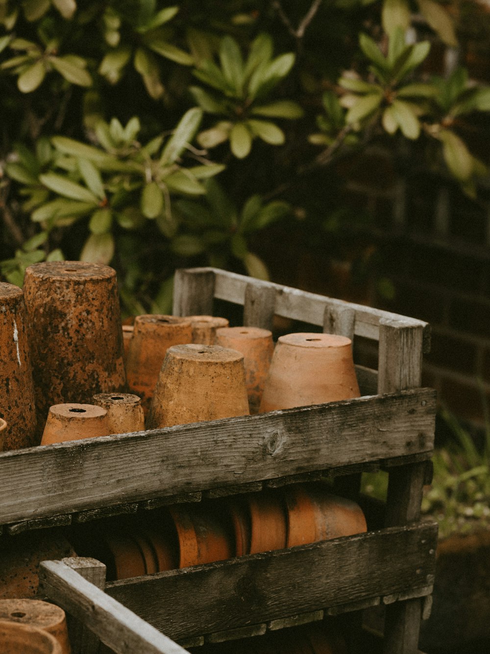 brown clay pot lot close-up photography