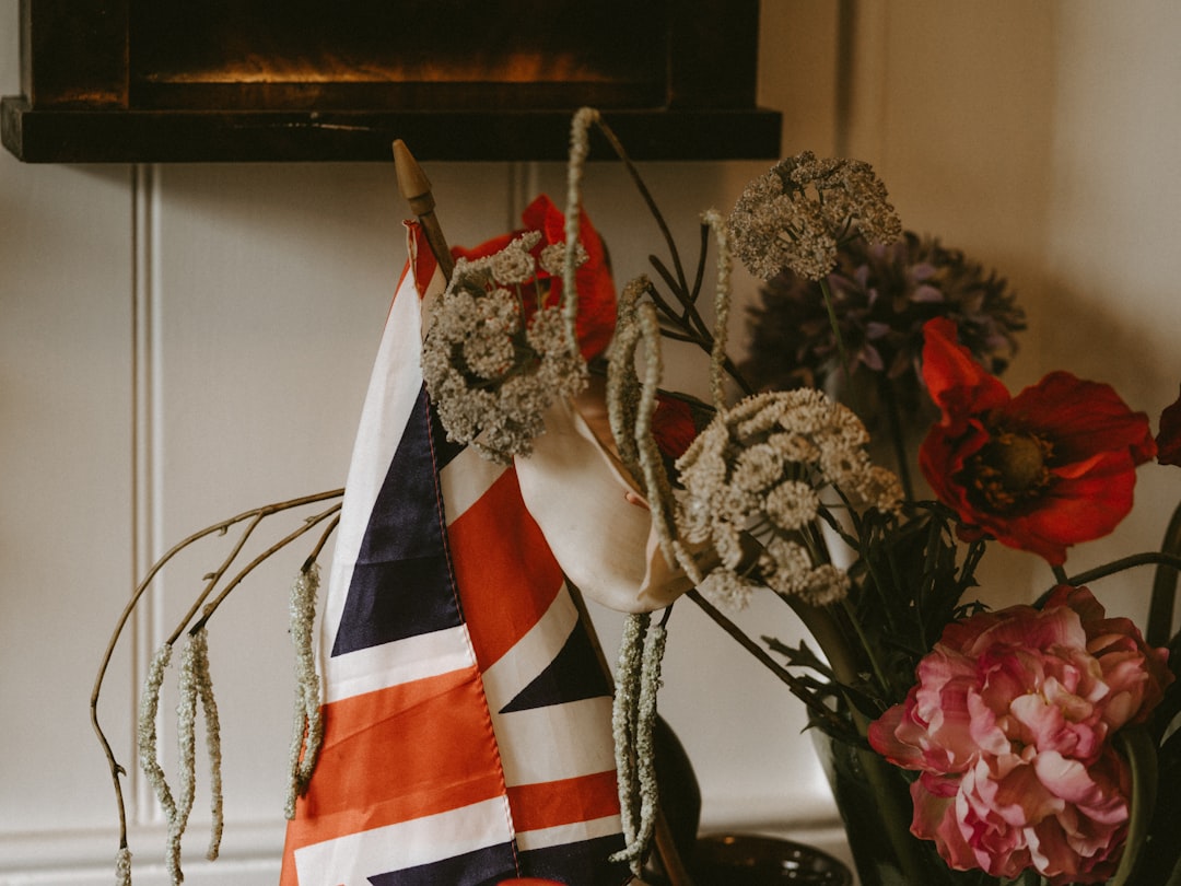 flaglet of UK beside flower arrangement