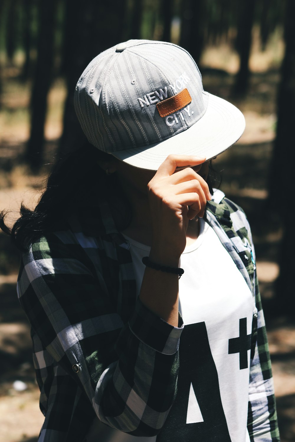 woman in gray cap and sports shirt