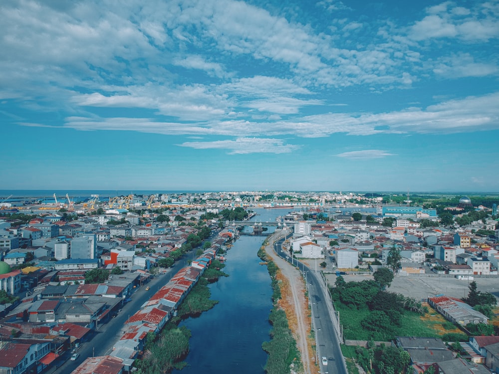 city and body of water during day