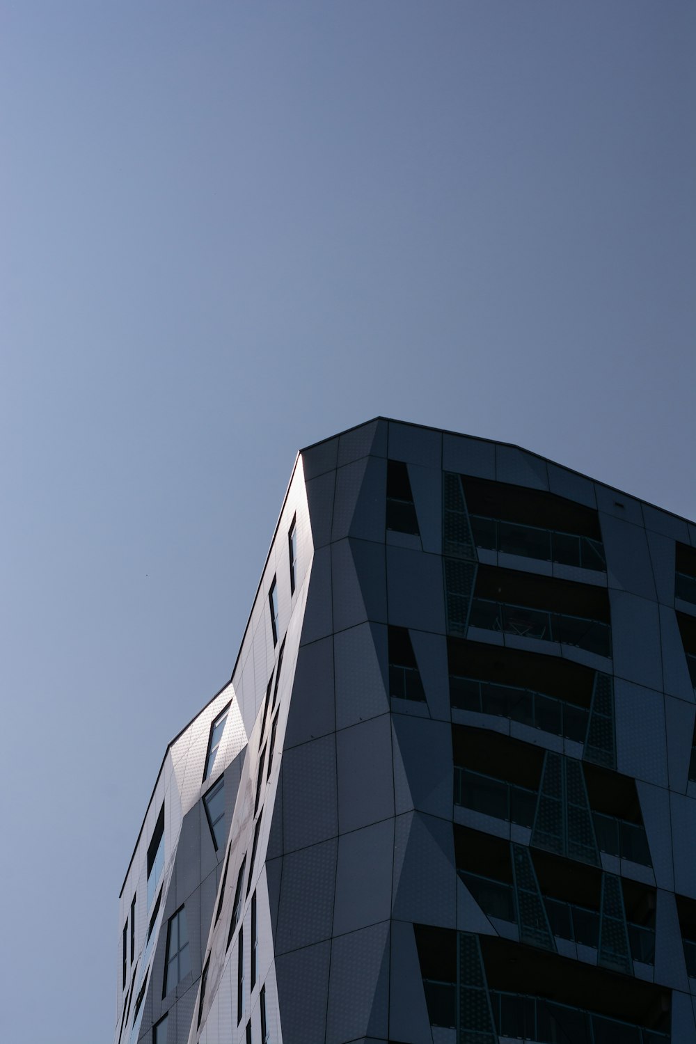 gray and black glass walled building