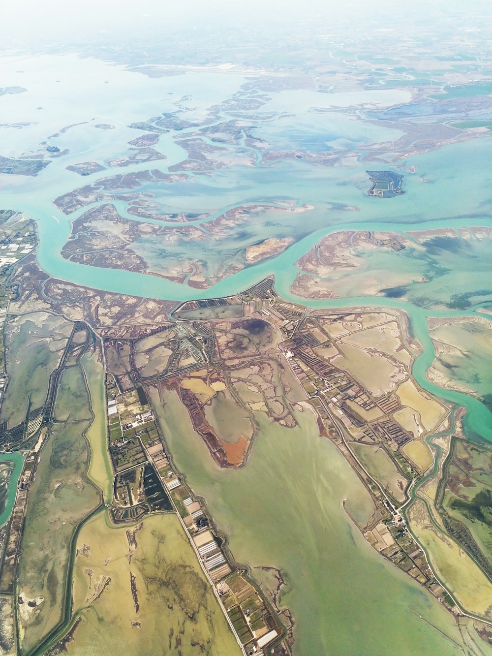 aerial photography of houses viewing field and sea