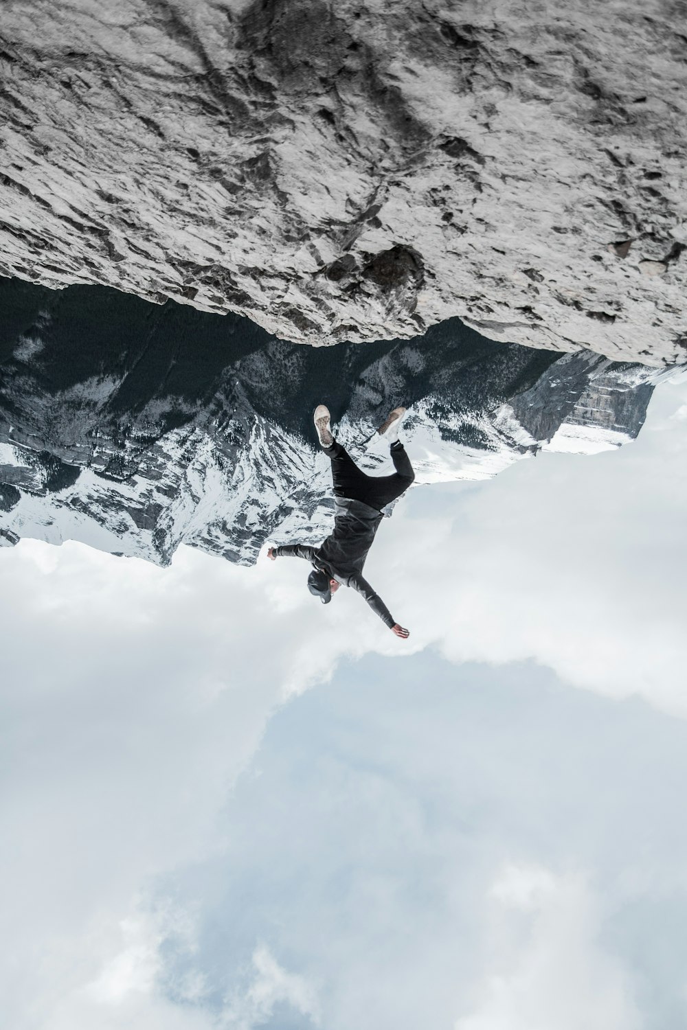 man standing on rock formation