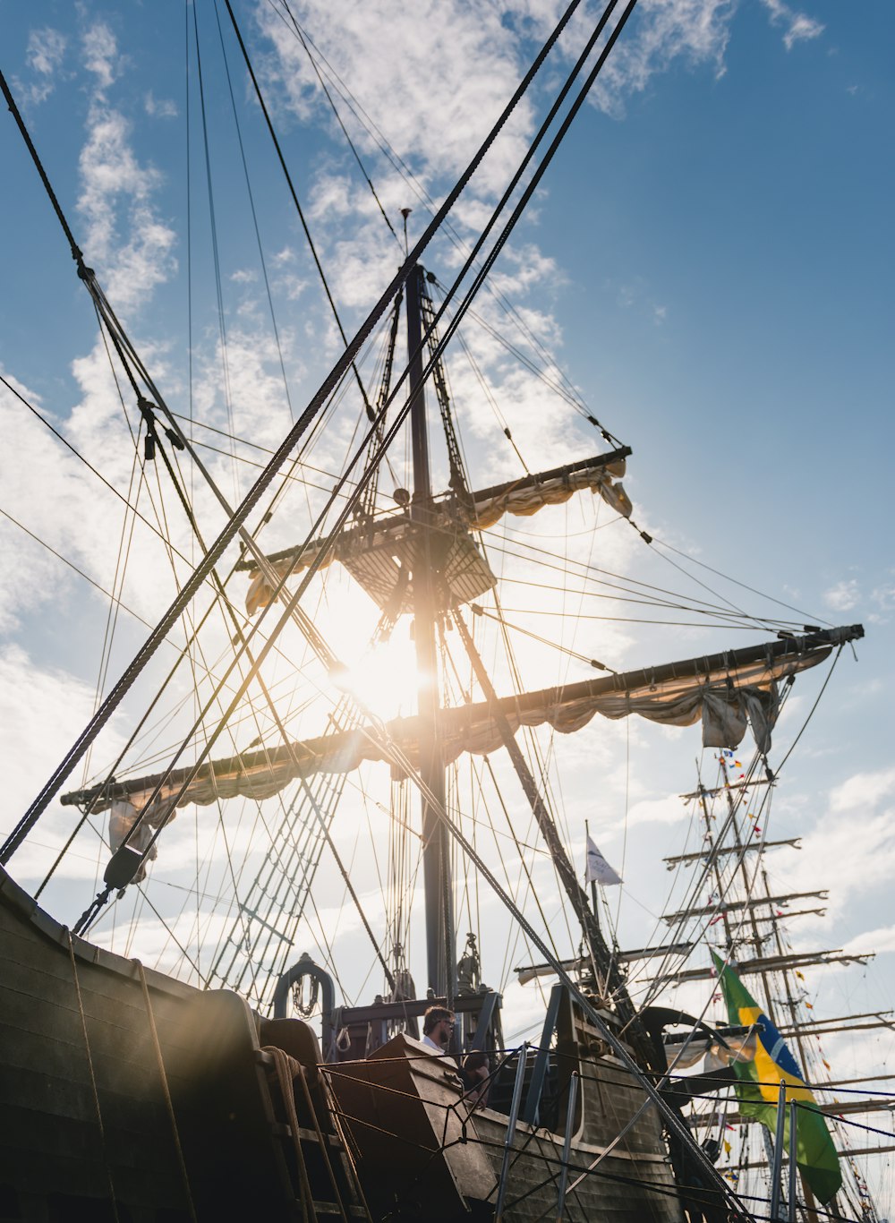 brown wooden galleon ship with Brazil flag