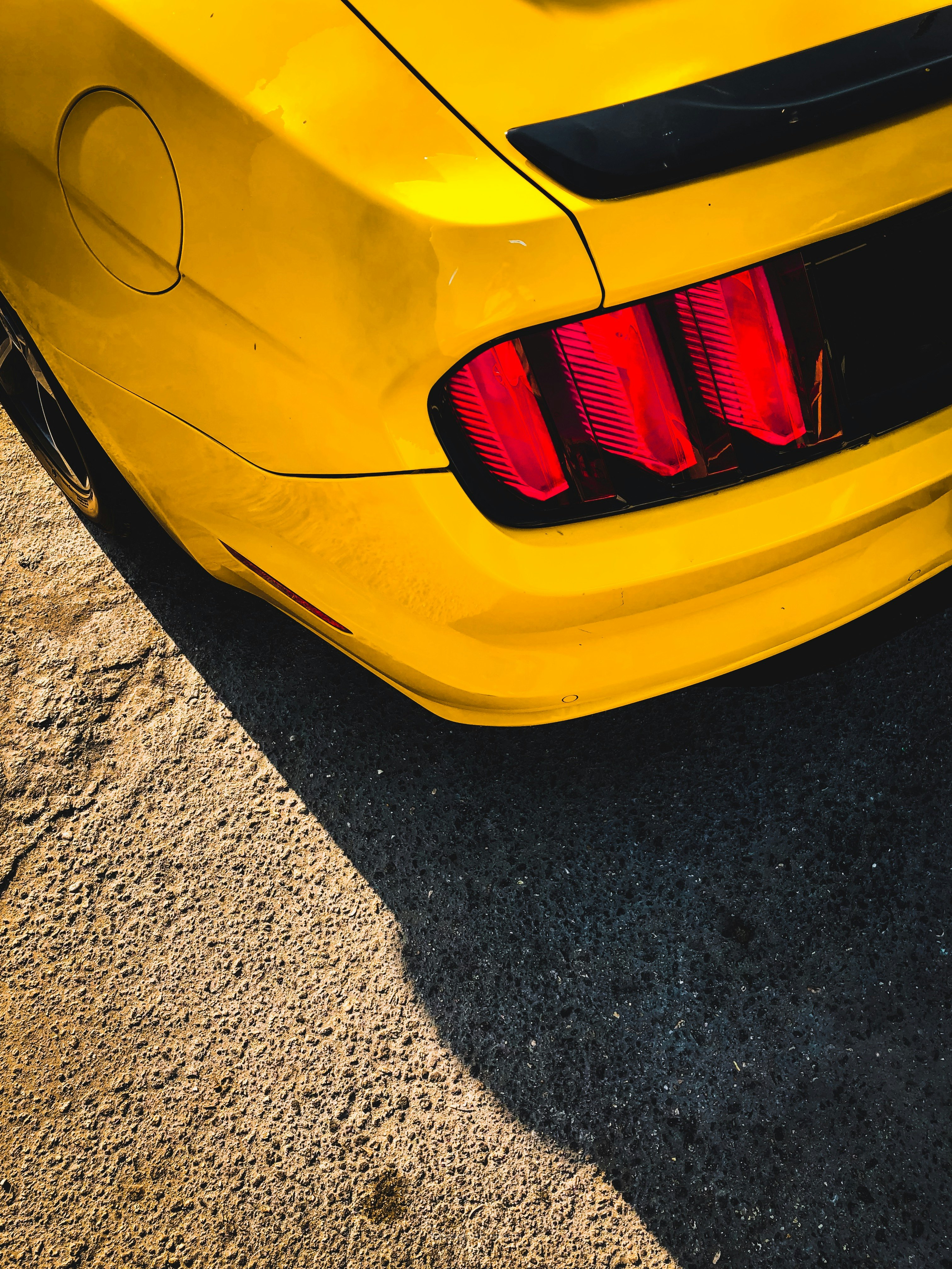 yellow vehicle showing taillight