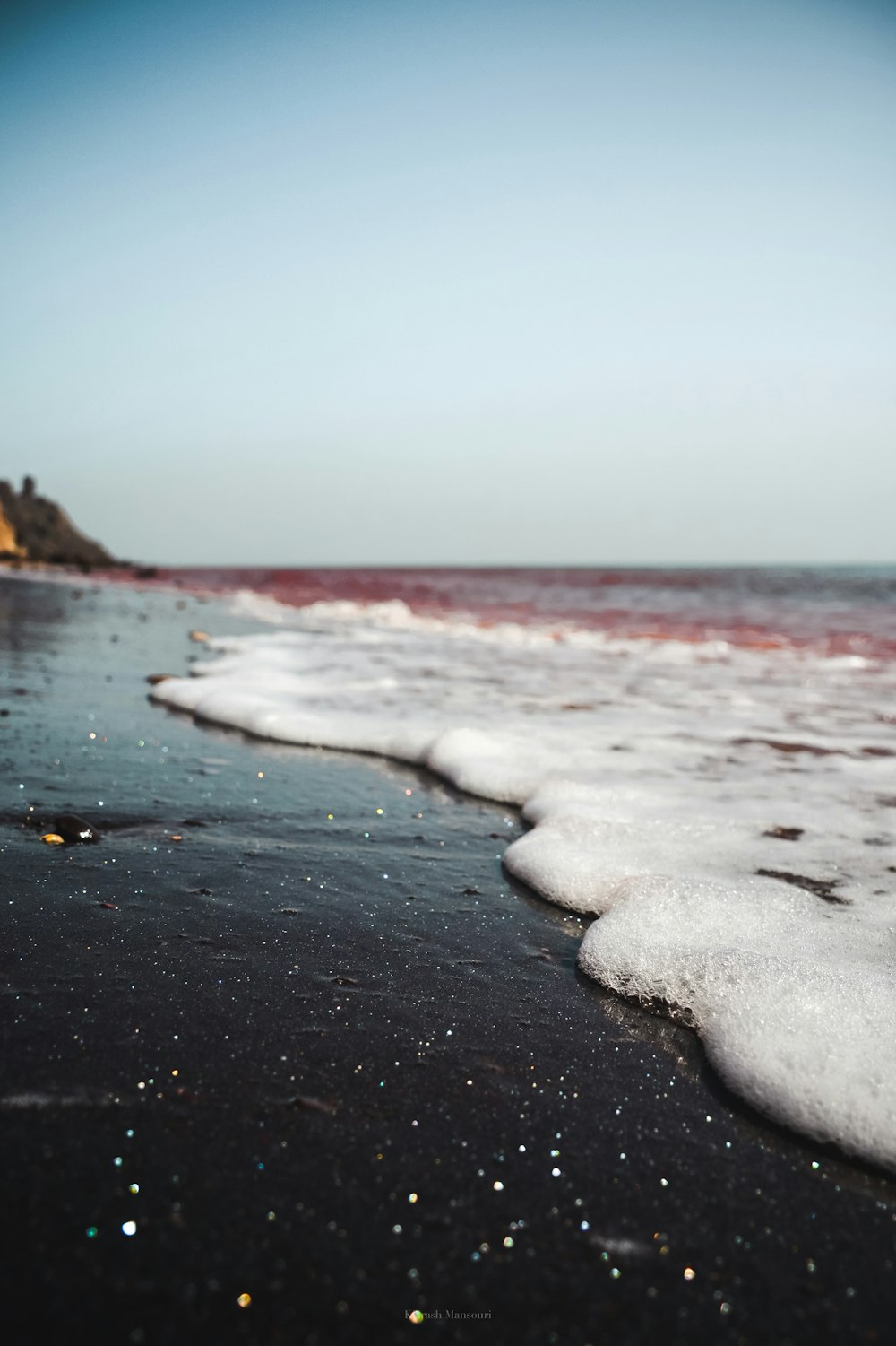 sea wave bubbles on shore