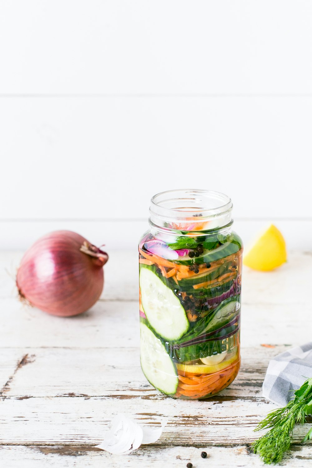 clear glass bottle on white table