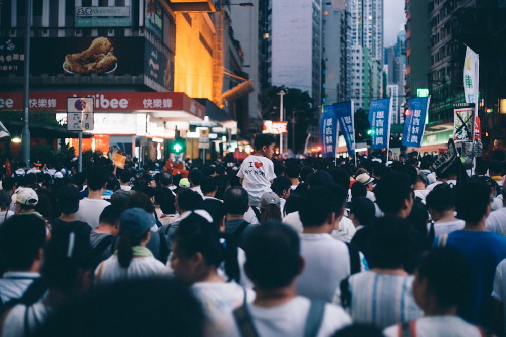 group of people standing near building