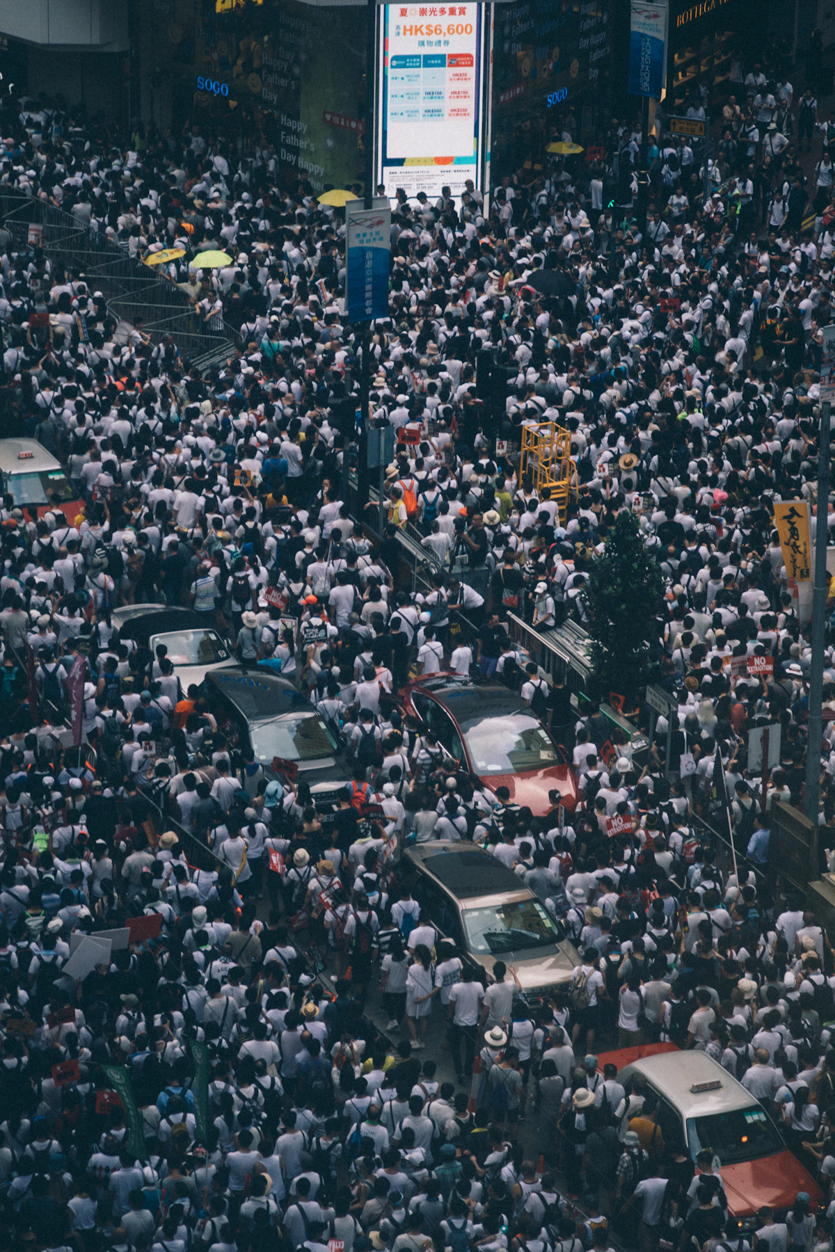 People gathered near a large building