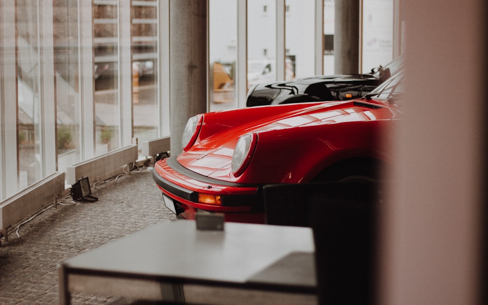 red car near table