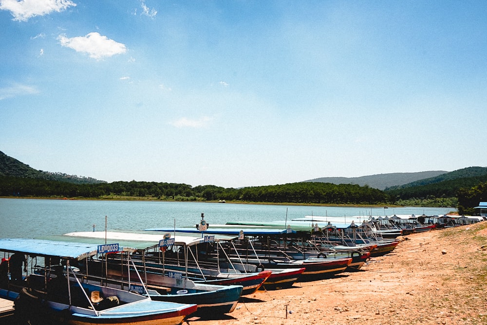 boats on seashore near ocean