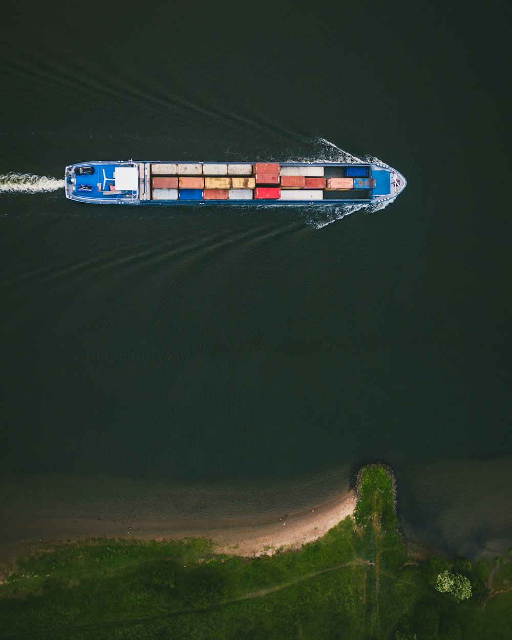 cargo ship on body of water