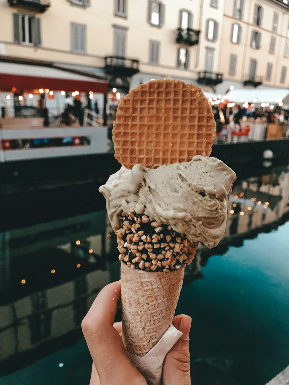 coffee flavor ice cream with waffle and sprinkles in cone